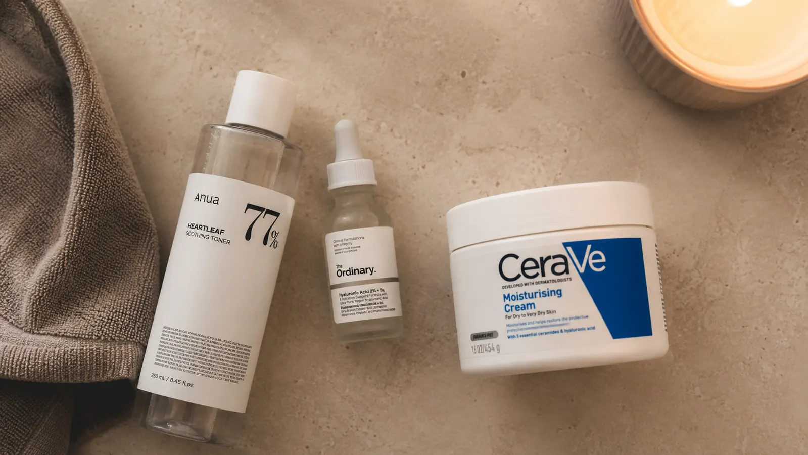 Flat-lay of the CeraVe night cream jar next to a simple skincare routine lineup